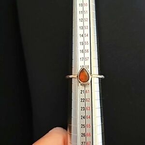 Sterling silver ring with orange/red center stone